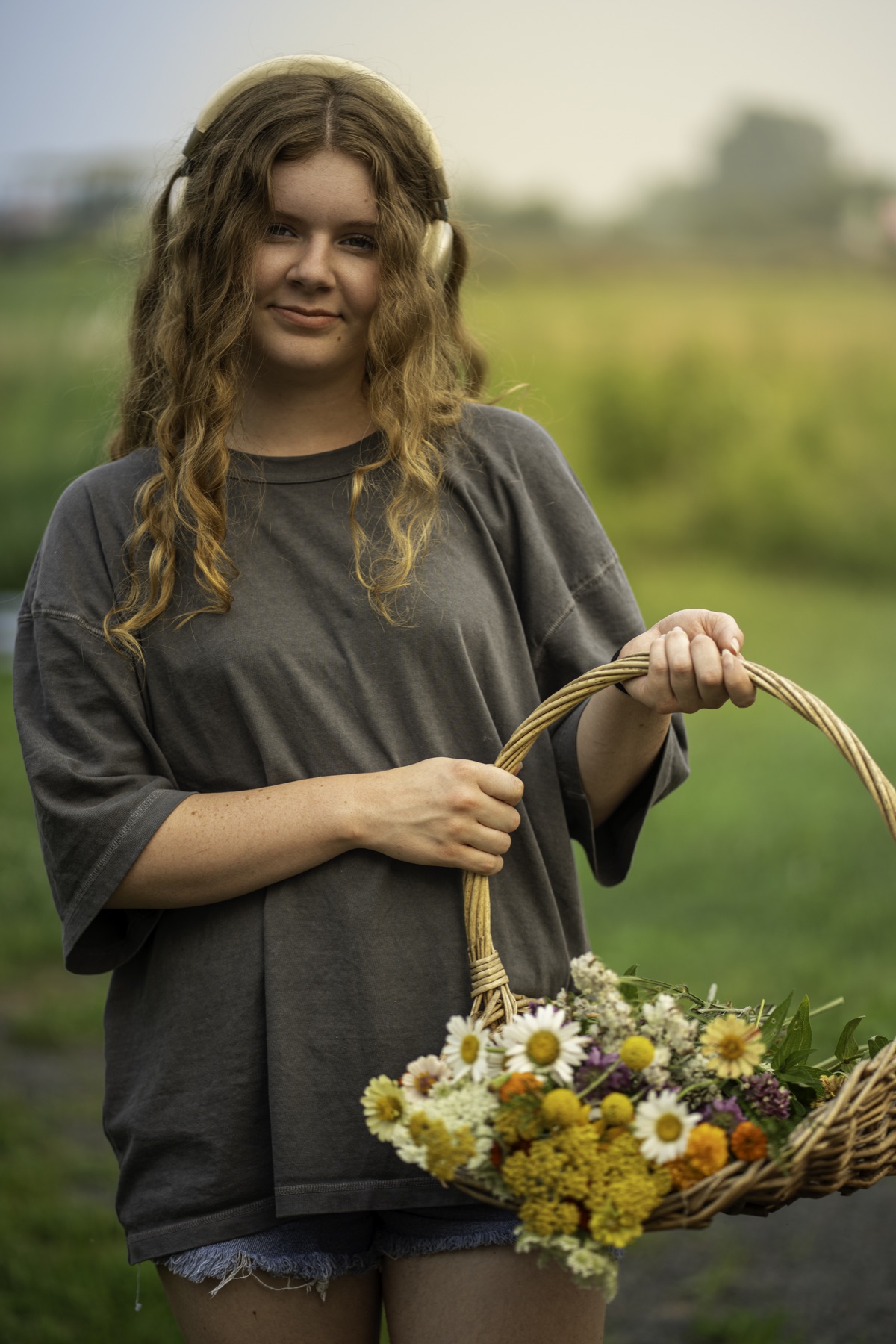 Outdoor portrait holding a basket of flowers